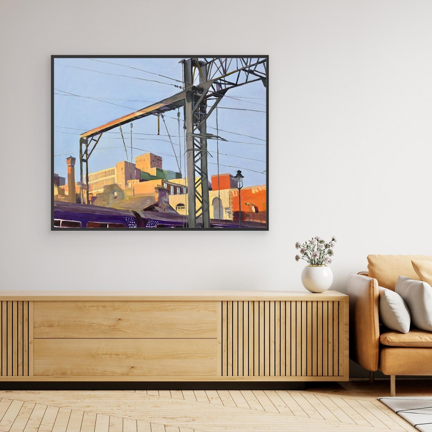 canvas print hanging on a white wall next to green vases with showdrops